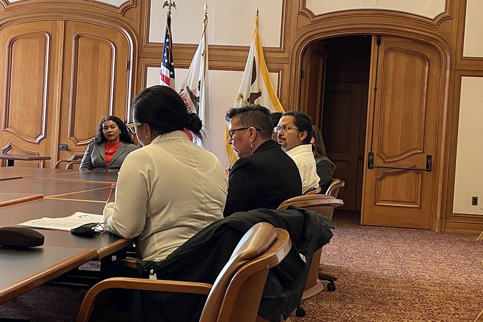 Mayor Breed listens to Maria Salazar-Colón at Friday's meeting at City Hall