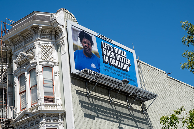 A billboard featuring an IFPTE Local 21 member, reading "Let's Build Back Better in Oakland"