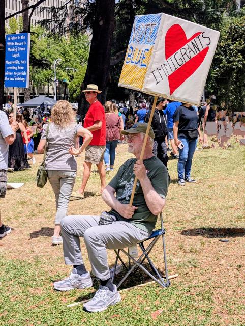 A protester in Sacramento shows his support for immigrants