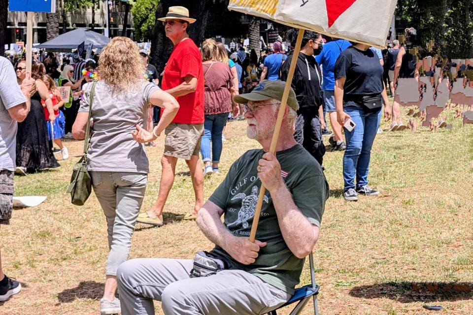 A protester in Sacramento shows his support for immigrants