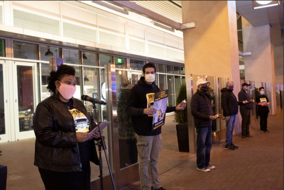 App workers protest outside Uber's headquarters.