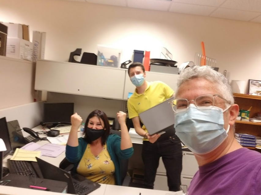 Felix Thomson and their colleagues in the University of Wisconsin Health organizing campaign take a break to pose for a photo.